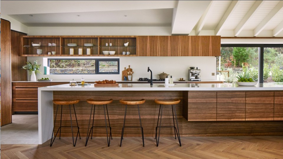 a kitchen with wooden cabinets and white counter tops