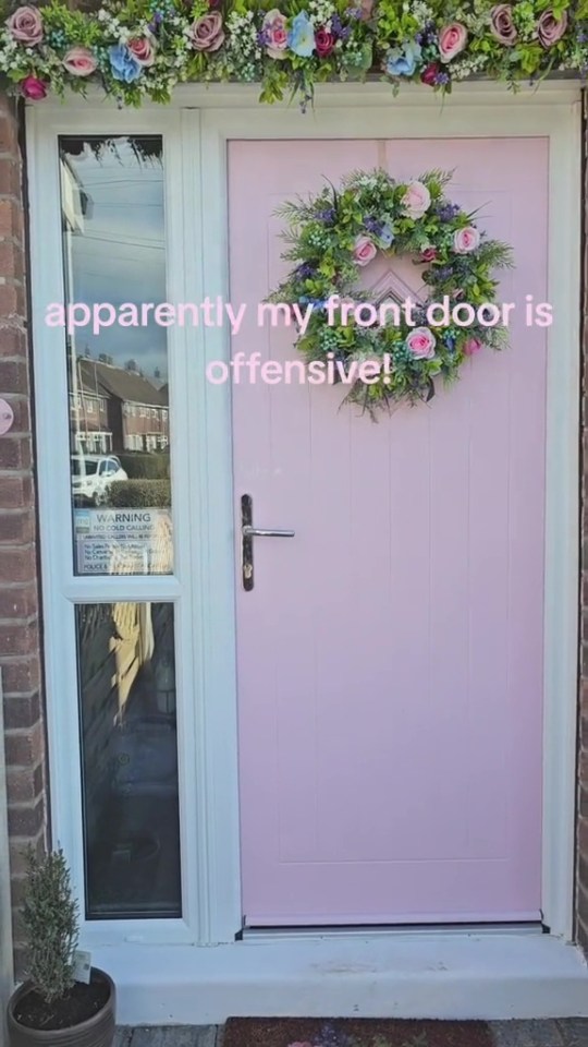 A woman claims her pink front door has been reported for being 'offensive'