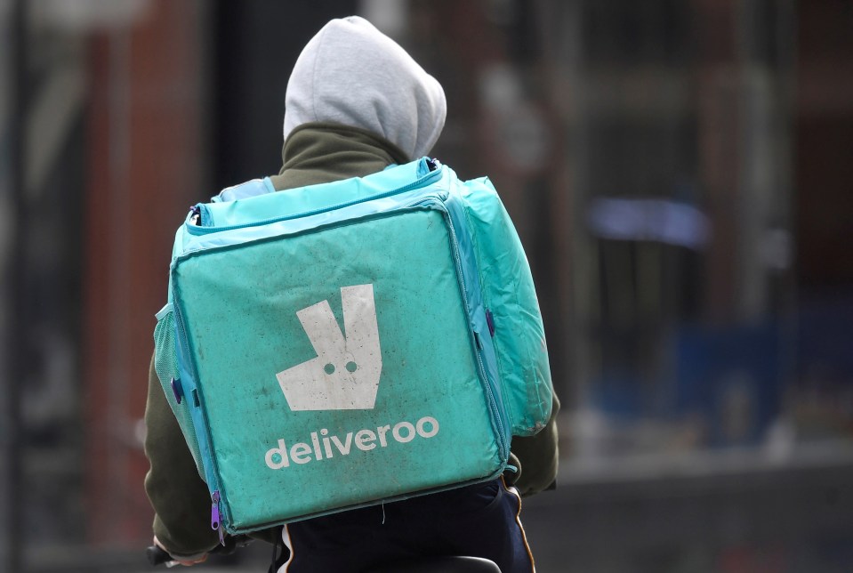 FILE PHOTO: A Deliveroo delivery rider cycles in London, Britain, March 31, 2021. REUTERS/Toby Melville/File Photo GLOBAL BUSINESS WEEK AHEAD