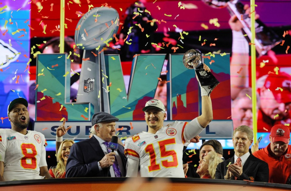 Football - NFL - Super Bowl LVII - Kansas City Chiefs v Philadelphia Eagles - State Farm Stadium, Glendale, Arizona, United States - February 12, 2023 Kansas City Chiefs' Patrick Mahomes celebrates with the Vince Lombardi Trophy alongside Carlos Dunlap, Chiefs chairman and CEO Clark Hunt and Chiefs head coach Andy Reid after winning Super Bowl LVII REUTERS/Brian Snyder