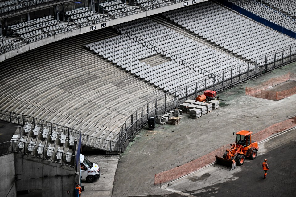 The running track which is normally hidden below the football pitch is being unearthed ahead of the Olympics in summer