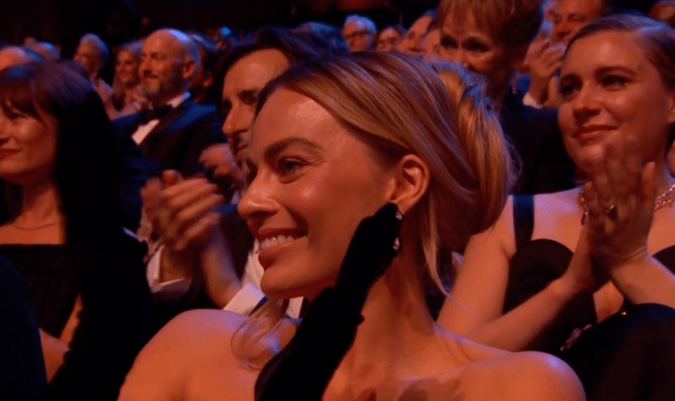 Margot beamed with happiness for her pal Emma Stone