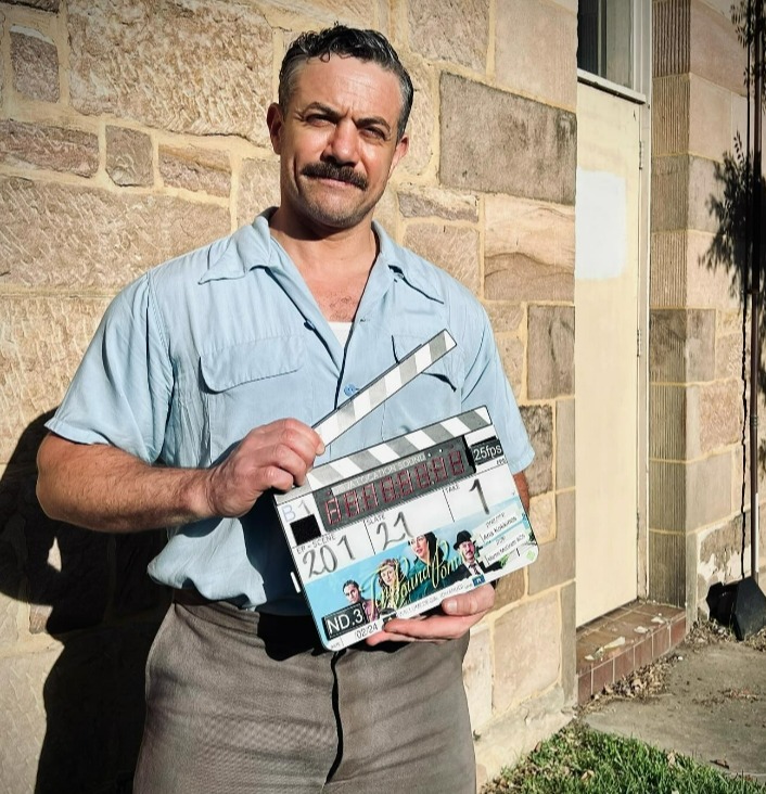 Warren posed with a clapper board on set as they kicked off filming