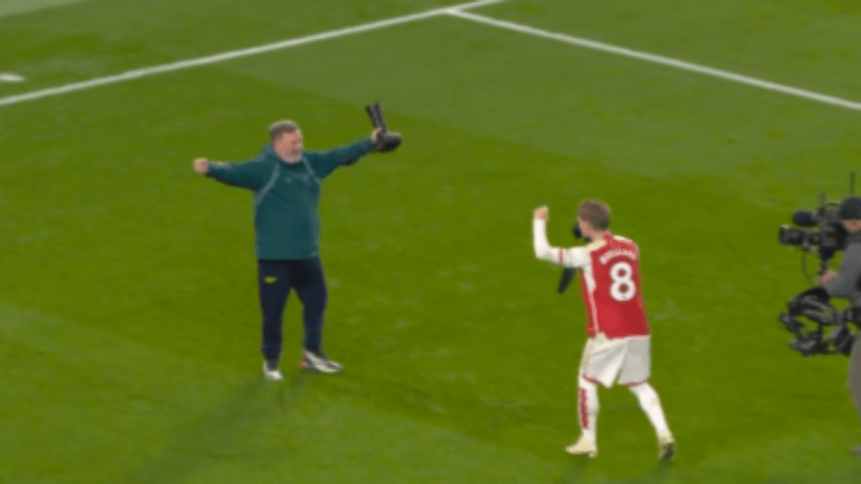 Martin Odegaard celebrated on the pitch with McFarlane after the win