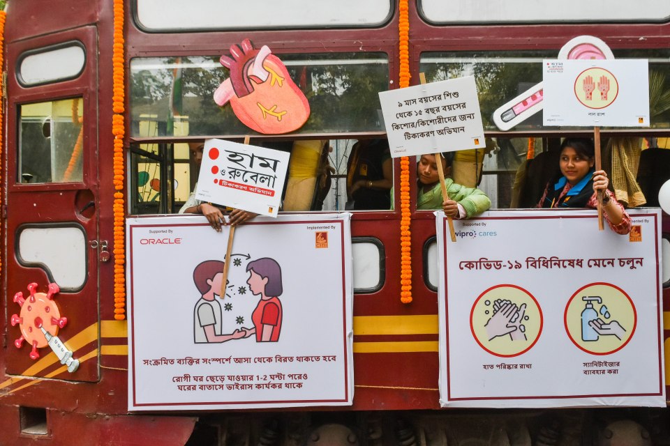 Activists holding placards during a measles campaign in Kolkata, India