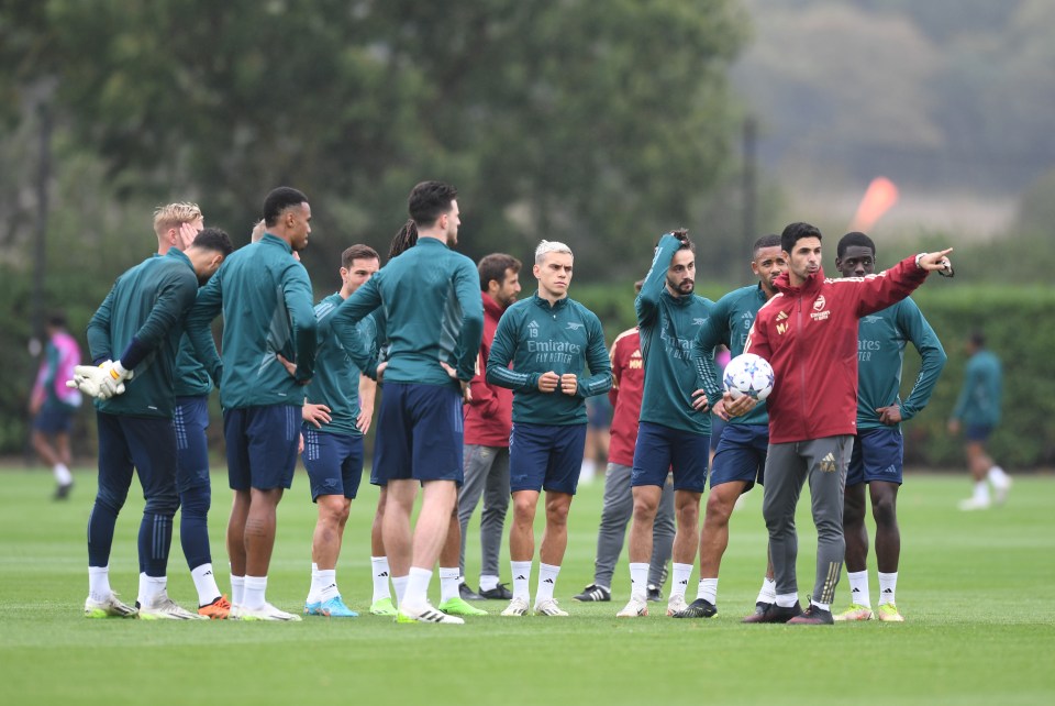 Arsenal boss Mikel Arteta pictured talking to his squad at training this week