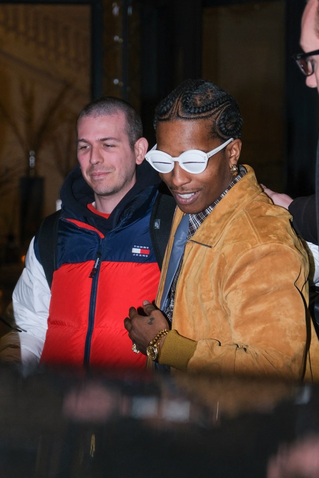 The rapper wore a pair of bonkers white sunglasses outside the Palazzo Parigi hotel