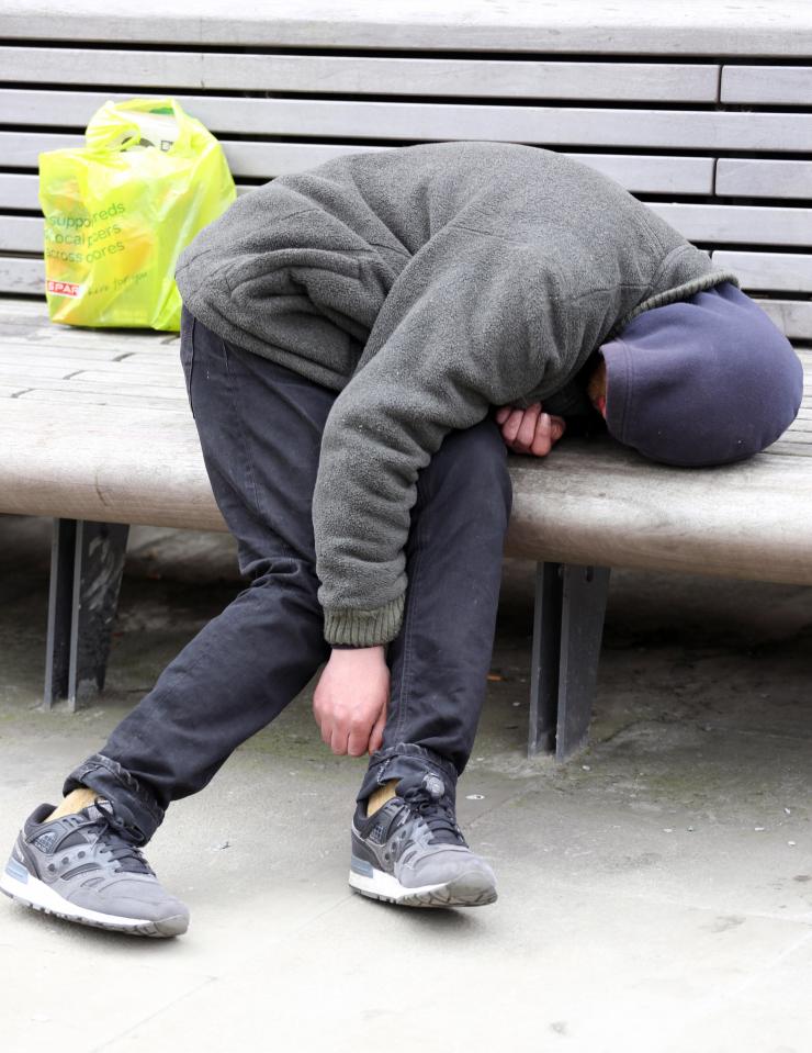 A young man unable to stand up, thought to be one of the many homeless using Spice,  which leaves users in a zombie state