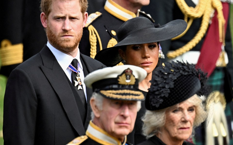 Harry and Meghan pictured a few feet behind King Charles and Camilla at the funeral of Queen Elizabeth