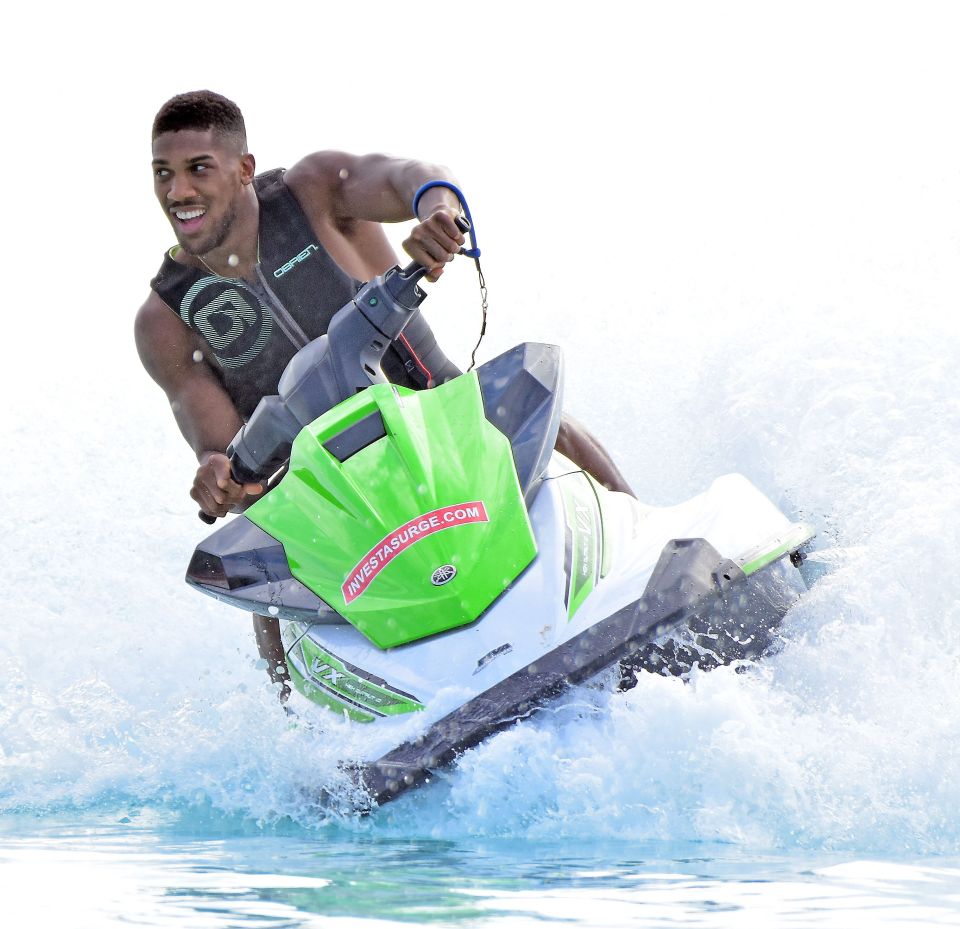 AJ enjoys the high-life and goes on glam holidays around the world, enjoying fun sea activities like jet-skiing