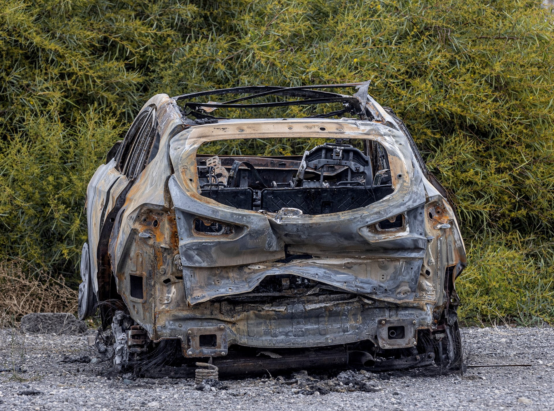 A burned car allegedly used by the perpetrators of the murder of Kuzminov to escape the scene