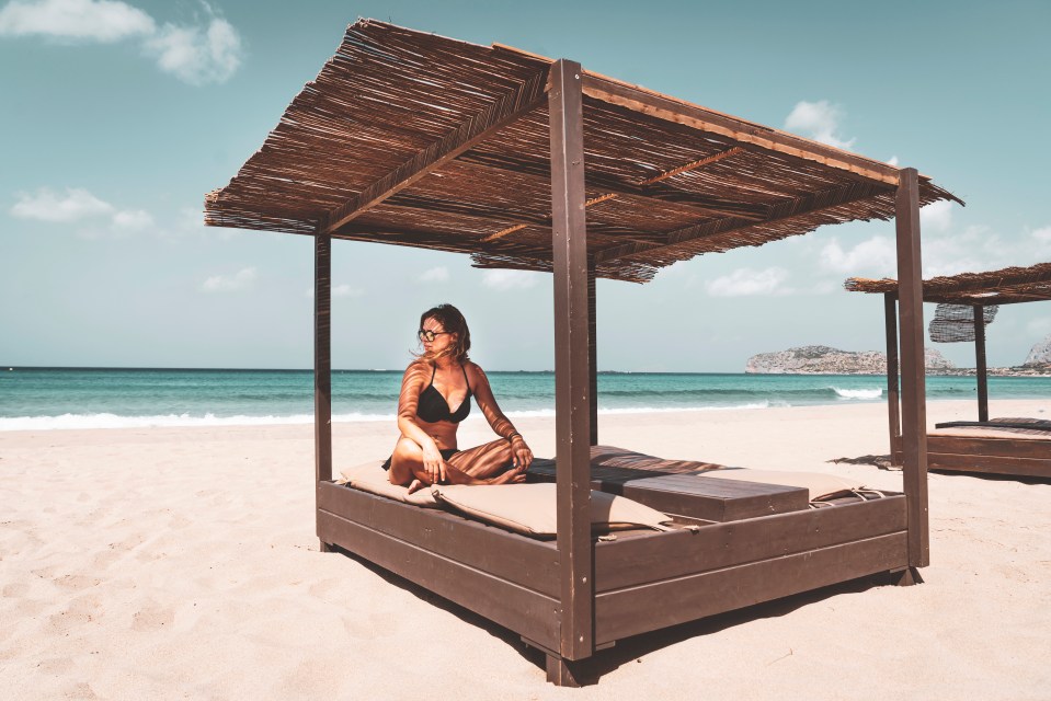 Tuck your toes into white and pink sands at Falassarna beach in Crete