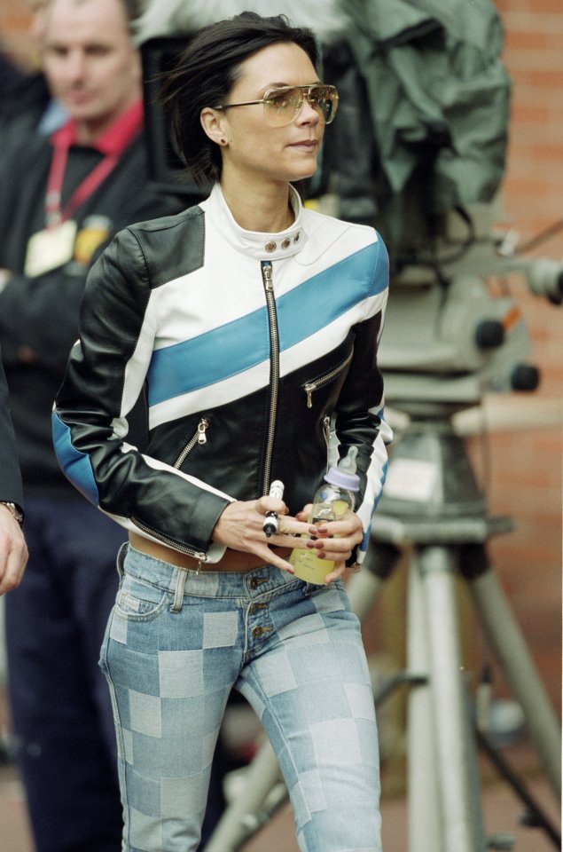 Victoria wearing the leather jacket at a Man Utd match