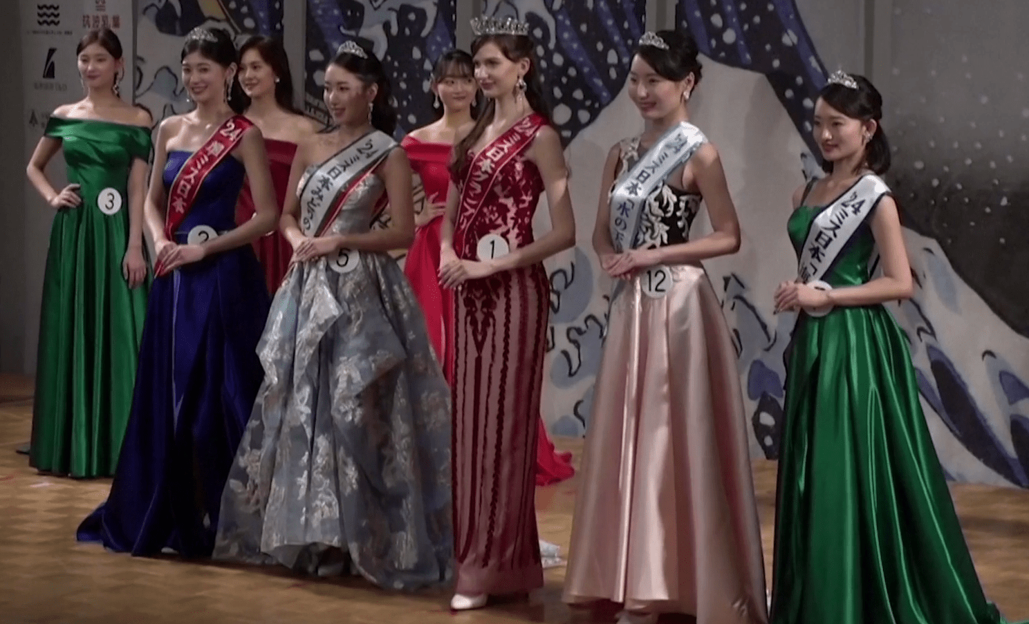 Shiino, standing in the middle wearing the crown, is the only naturalised Japanese citizen to have won the Miss Japan title ever