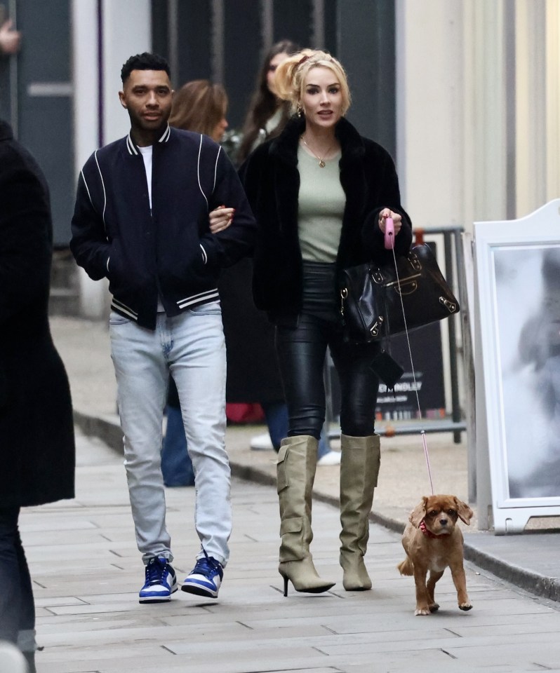 Jermaine Pennant is pictured arm in arm with Charlotte Kirk in central London