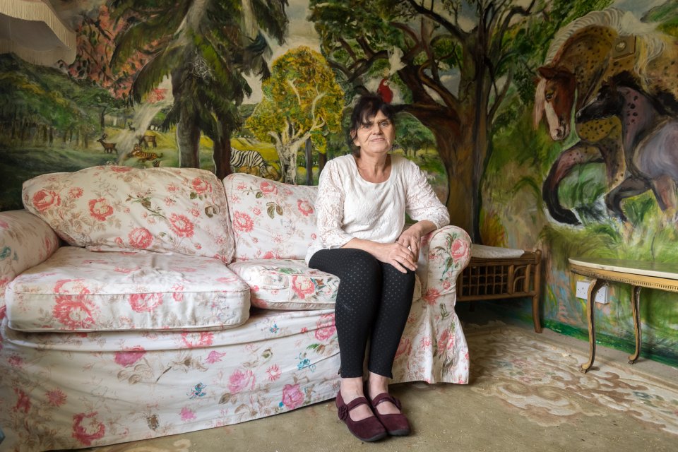 Diana spent 35 years using just her fingers to paint her walls