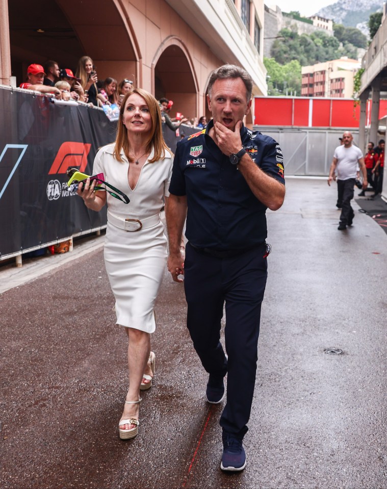 Toto Wolff of Mercedes on a scooter is passing by Christian Horner of Red Bull Racing and his wife Geri Halliwell after F1 Grand Prix of Monaco at Circuit de Monaco on May 28, 2023 in Monte-Carlo, Monaco. (Photo by Beata Zawrzel/NurPhoto via Getty Images)