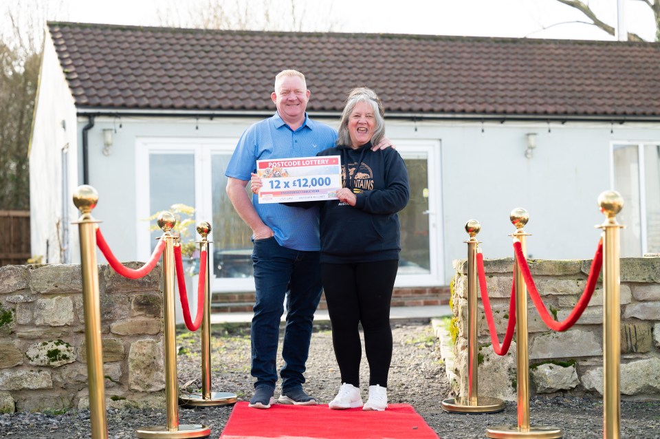 Meg and her husband Andy with the winning ticket