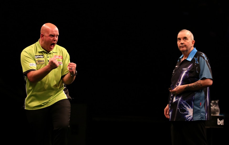 Michael van Gerwen with Phil Taylor in 2015