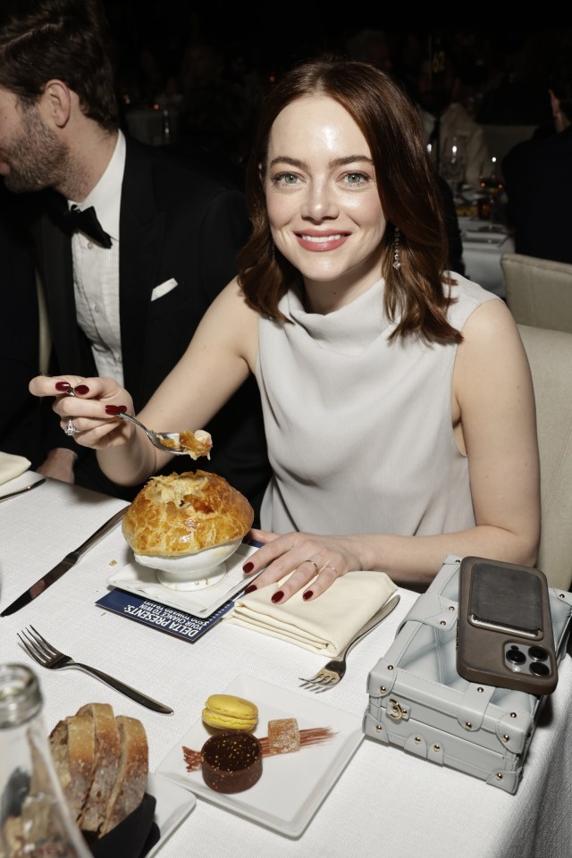 Emma Stone grinned as she tucked into a chicken pie