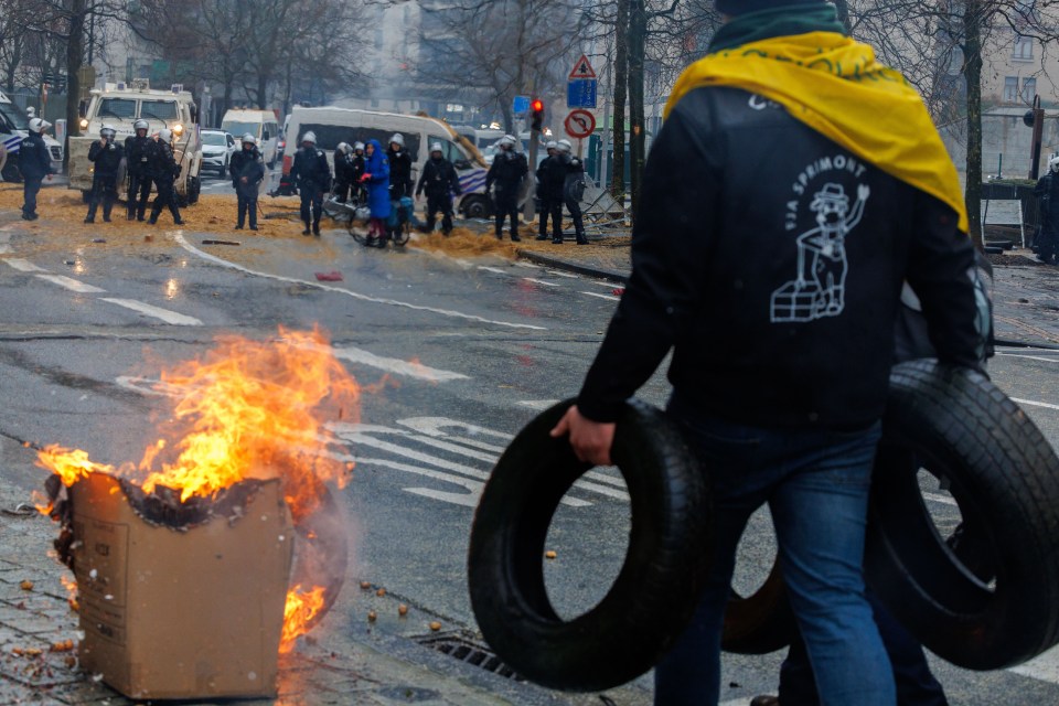 People burn tires during a protest of European farmers in Brussels, Belgium