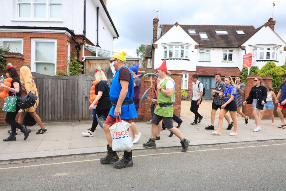 Many make the 15-minute pilgrimage from the train station to the stadium, along residential streets