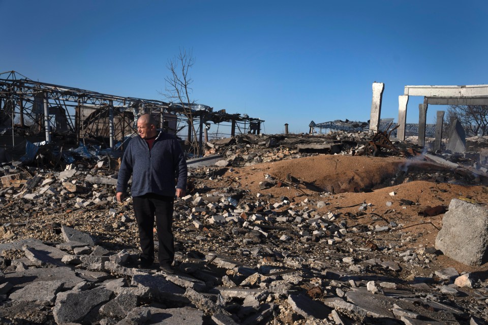 Farmer Volodymyr Melnikovych looks at the ruins of his farm after a Russian rocket attack in the village of Kiseliovka, close to Kherson, Ukraine