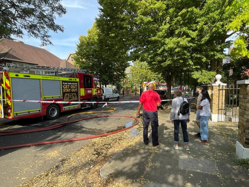 Firefighters at Lisa and Ant's old house in Chiswick after a huge blaze