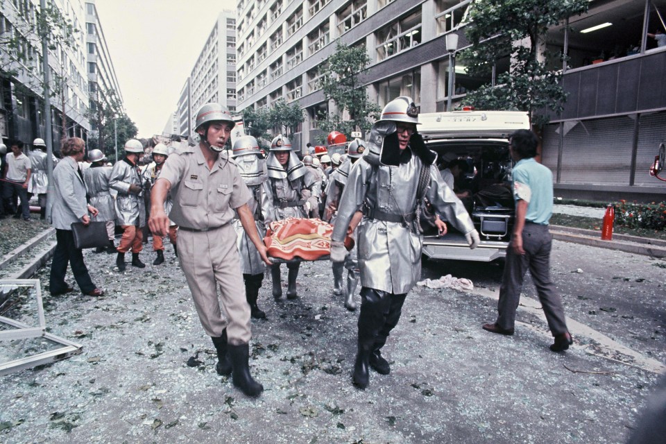 Emergency services rush to the scene after the 1974 Mitsubishi bombing