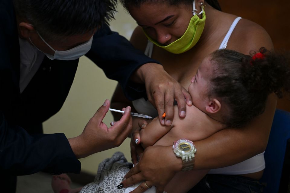 A girl receives a dose of the MMR jab in Caracas, Venezuela