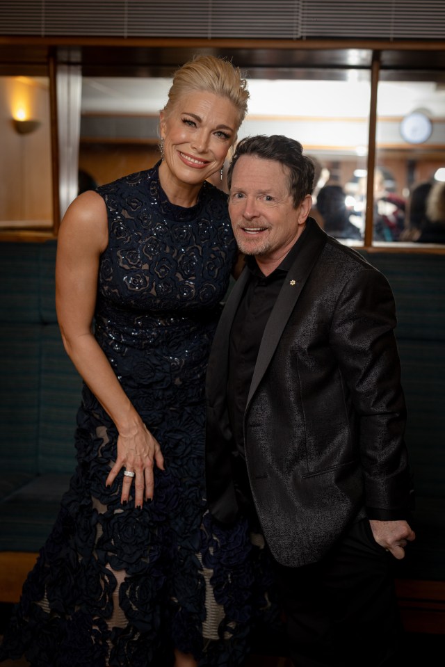 Michael poses with Ted Lasso star Hannah Waddingham backstage