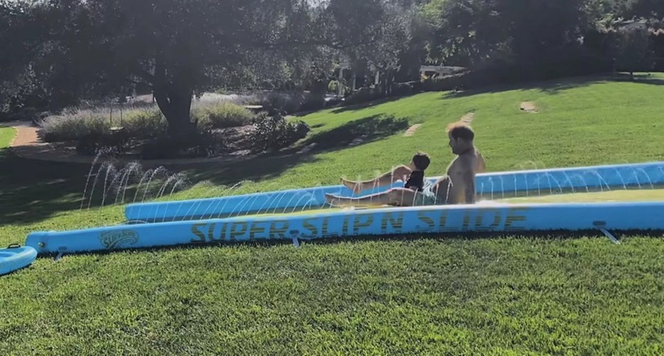 The family often make the most of their large garden, and Prince Harry previously took Archie on a slip n slide