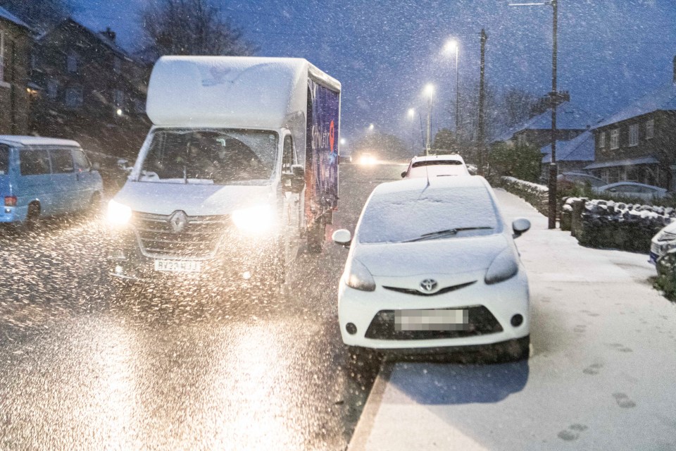 Heavy snow showers start to fall in the town of Buxton, Derbyshire, this morning