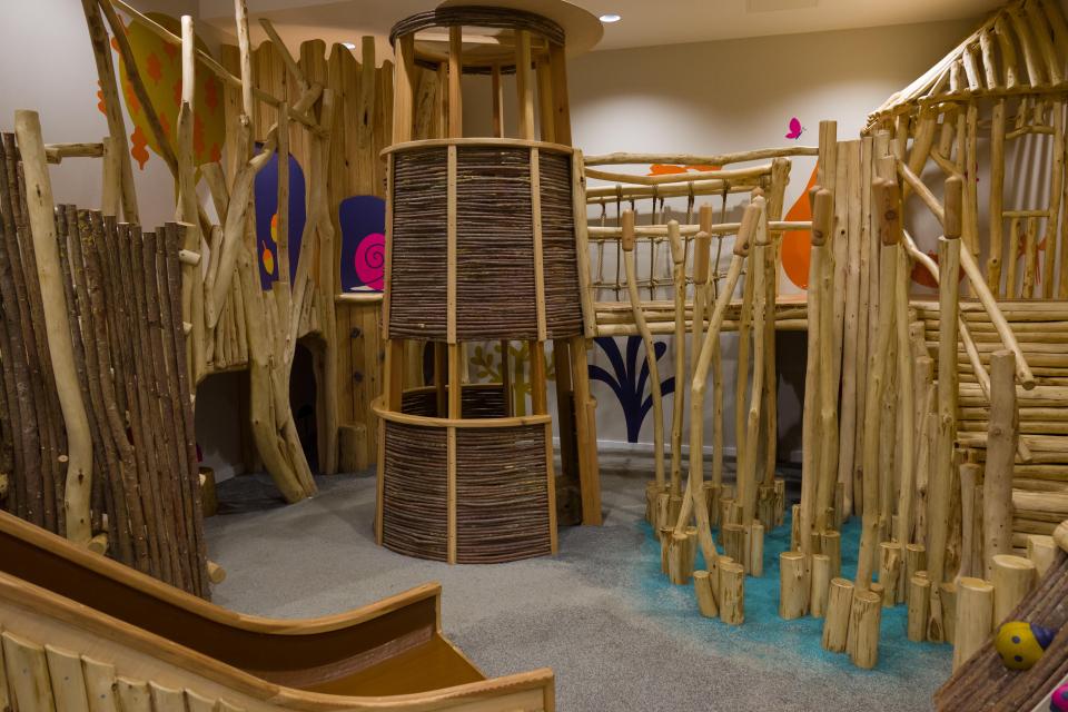 The children's play area is all constructed from wood