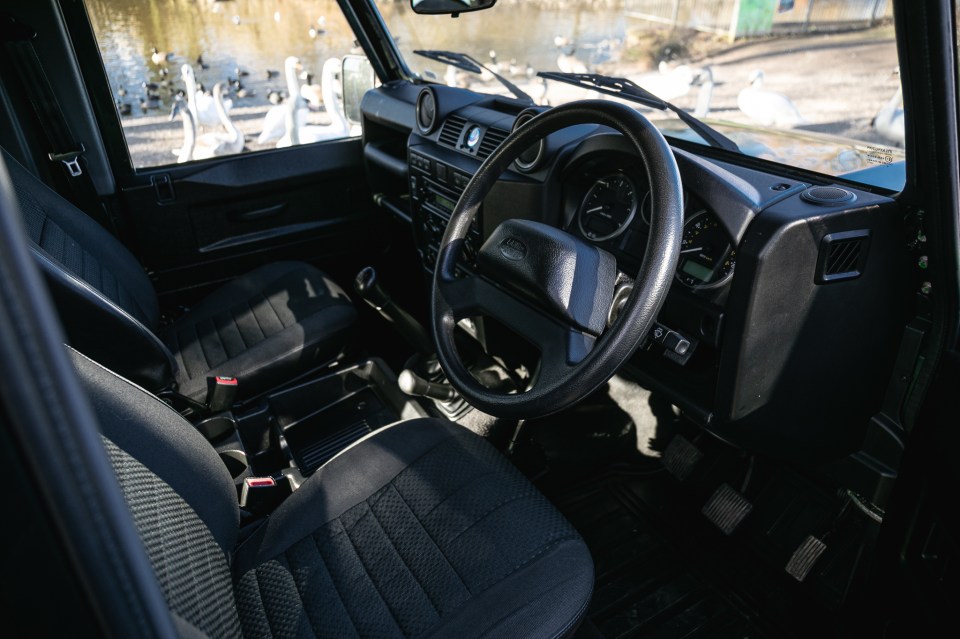 The Land Rover is in Galway Green with a black cloth interior