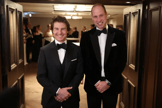 Prince William poses for a photo with Tom Cruise at the charity gala