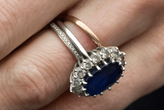 The delicate ring could be easily missed next to Kate's sapphire