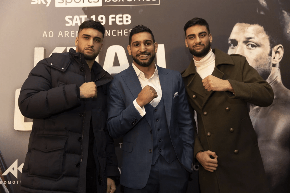 Adam Azim, left, with Amir Khan and brother Hassan