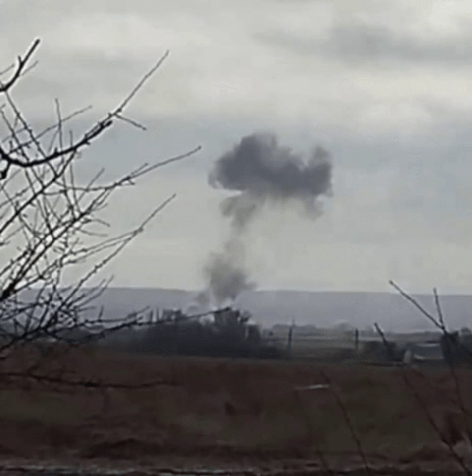 Thick black smoke rises from the ground after the explosion