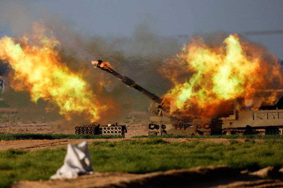 An Israeli artillery unit fires towards Gaza, as the war rages on