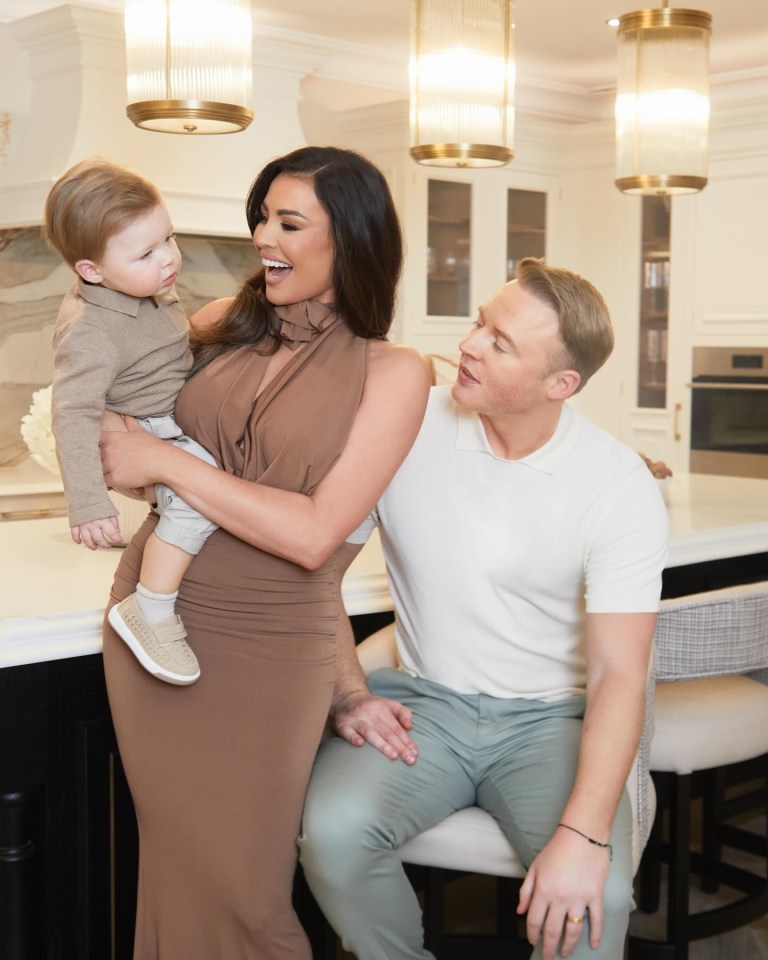 Jess posed with her family in their newly renovated kitchen