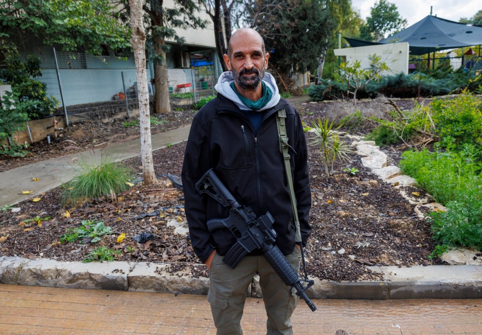 Builder Eran Betito, a 46-year-old father of three, was the first Be’eri resident to come back to the kibbutz — armed with an assault rifle just two days after the mayhem