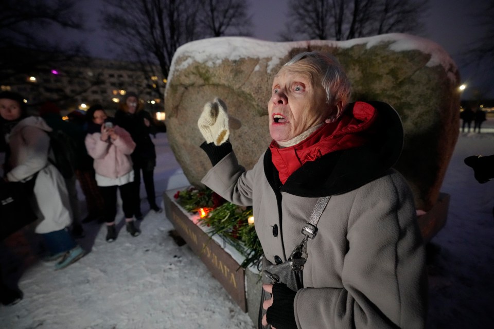 Lyudmila, 83, addresses people gathered to lay flowers paying their last respect to Navalny