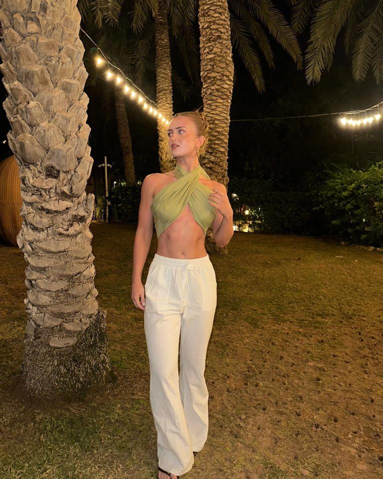 The actress showed off her washboard abs on holiday