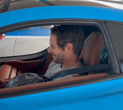 Marc Priestley behind the wheel of a McLaren supercar