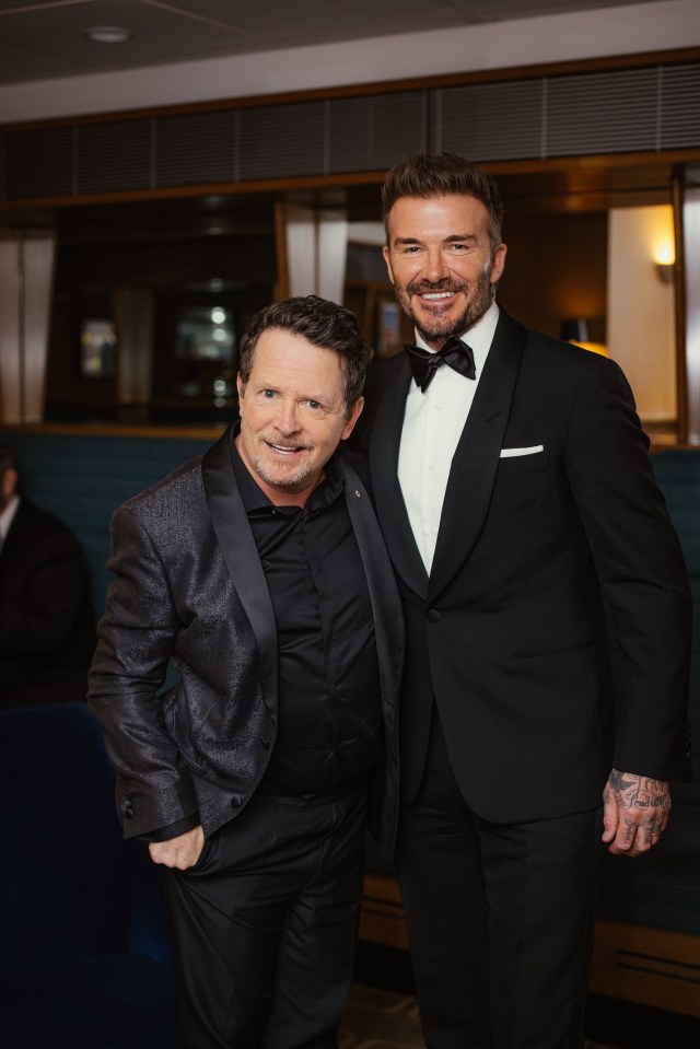 Michael poses with football legend David Beckham