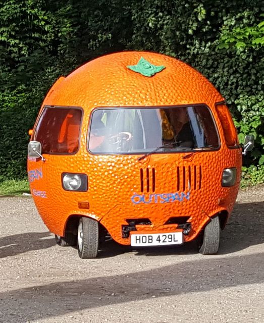 An orange car based on a classic Mini is another unusual addition