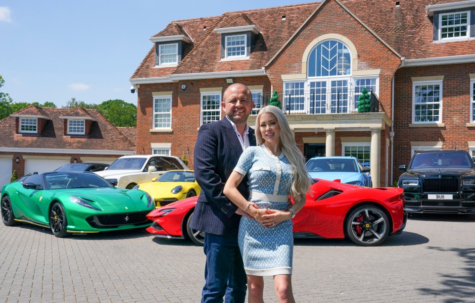 Bob Bull and his wife Sara Nilsen at their home last year with their fleet of supercars