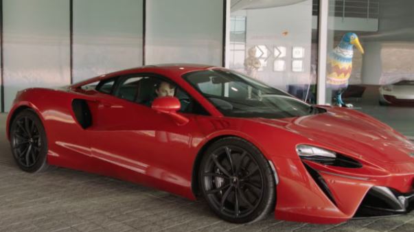 Oscar pictured driving his £180k company car in a promo for McLaren