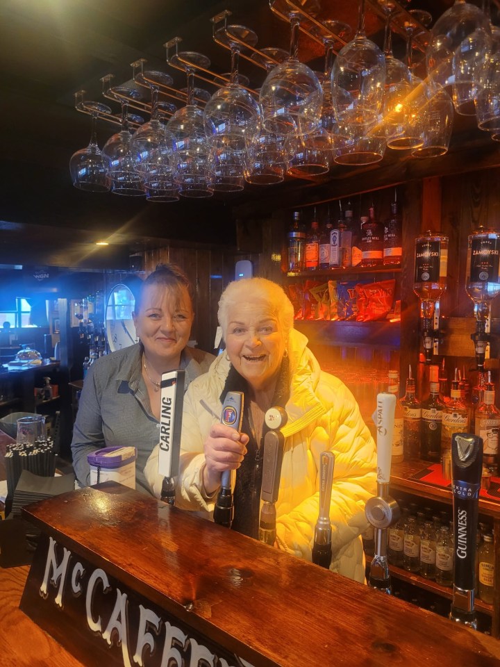 Pam posed for a picture behind the bar of a pub in Bicester, Oxfordshire